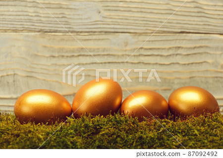 traditional easter golden eggs on wooden background traditional easter golden eggs on wooden background 87092492
