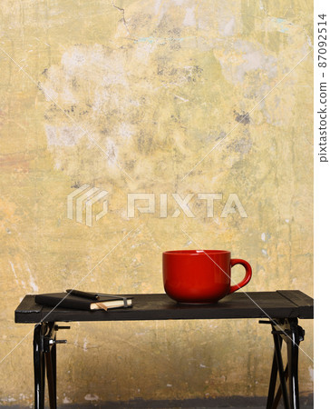 cup with copybook and pen 87092514