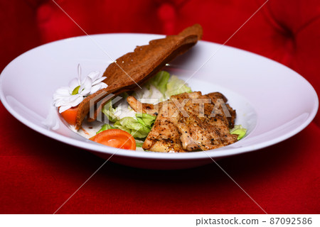 Dinner served on traditional plate. Main course and catering Dinner served on traditional plate. Main course and catering 87092586