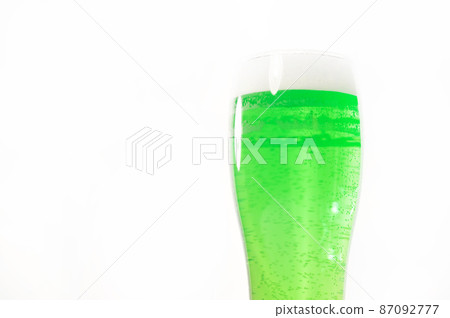 A pint of green beer for st patrick's day on a white background. Traditional Irish drink for a holiday A pint of green beer for st patrick's day on a white background. Traditional Irish drink for a holiday 87092777