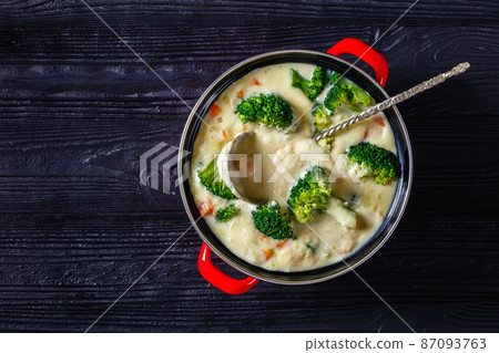 Broccoli cheese soup in a pot, top view Broccoli cheese soup in a pot, top view 87093763