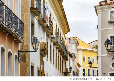 Old houses with balconies and lanterns in colonial style on the streets of Pelourinho Old houses with balconies and lanterns in colonial style on the streets of Pelourinho 87094064