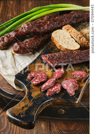Closeup view of dried sausage made of venison and turkey spicy meat 87094445