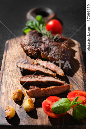 Closeup view of beefsteak spider fried in cast-iron pan Closeup view of beefsteak spider fried in cast-iron pan 87094459