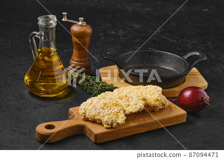 Chicken nuggets in breading ready for frying Chicken nuggets in breading ready for frying 87094471