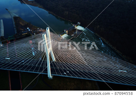Large bridge over river with cars traffic 87094558