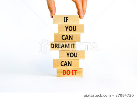 Dream and do it symbol. Wooden blocks with words If you can dream it you can do it. Beautiful white background, copy space. Businessman hand. Business, motivational dream and do it concept. 87094720