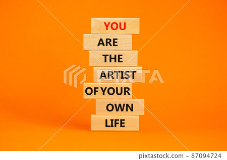 You artist of your life symbol. Wooden blocks with words You are the artist of your own life. Beautiful orange table, orange background, copy space. Business, motivational lifestyle concept. 87094724