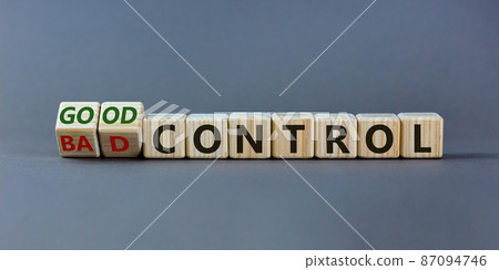 Bad or good control symbol. Turned wooden cubes and changed words 'bad control' to 'good control'. Beautiful grey background. Business and good control concept. Copy space. 87094746