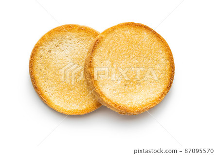 Dietary rusks bread. Crusty biscuits isolated on white background. 87095570
