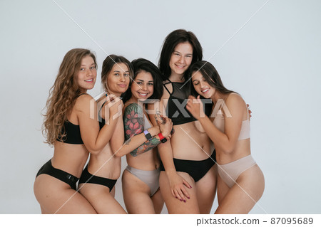 diverse models wearing comfortable underwear, enjoying time together diverse models wearing comfortable underwear, enjoying time together 87095689