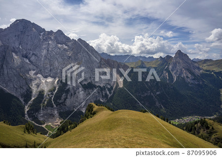 Dolomite peaks - Marmolada and Colac above Canazei. Dolomite peaks - Marmolada and Colac above Canazei. 87095906