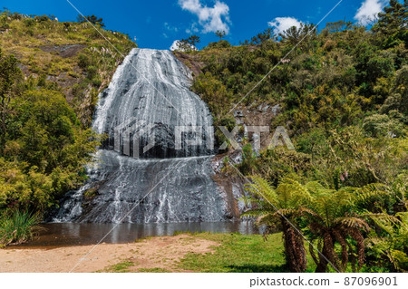 Popular Bride's Veil waterfall with tropical plants in Urubici, Santa Catarina, Brazil Popular Bride's Veil waterfall with tropical plants in Urubici, Santa Catarina, Brazil 87096901