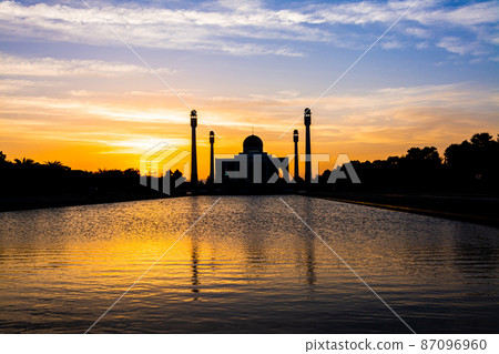 Songkhla Central Mosque in day to night with colorful skies at sunset and the lights of the mosque and reflections in the water in landmark landscape concept Songkhla Central Mosque in day to night with colorful skies at sunset and the lights of the mosque and reflections in the water in landmark landscape concept 87096960