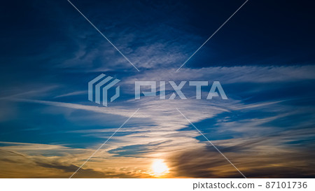 Vibrant beautiful winter sunset with angelic clouds Vibrant beautiful winter sunset with angelic clouds 87101736