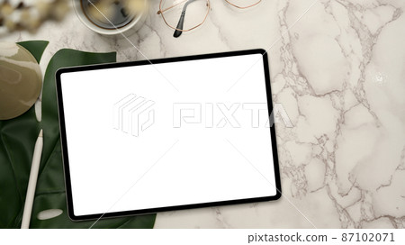 Stylish workspace top view, with digital tablet on marble white background. 87102071