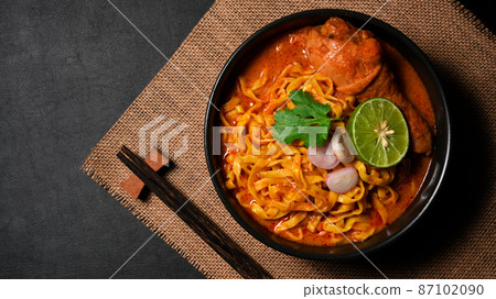 Top view, of Khao Soi Kai or noodles curry soup with chicken. 87102090