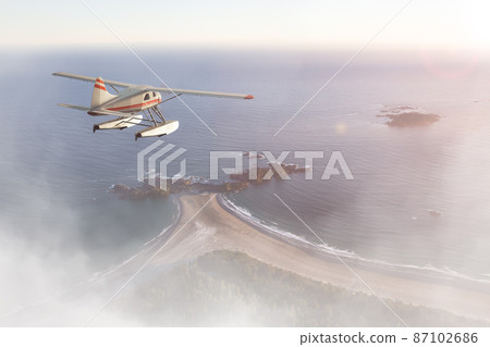 Seaplane Flying over the West Coast Pacific Ocean at sunset. 87102686