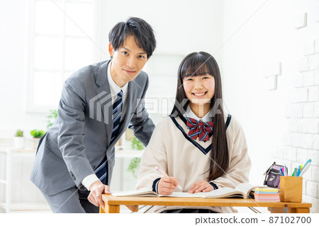 Girls and teachers studying in cram school Girls and teachers studying in cram school 87102700