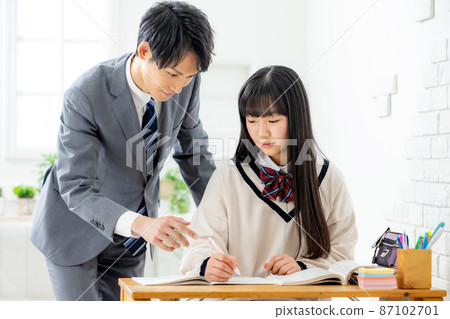 Girls and teachers studying in cram school Girls and teachers studying in cram school 87102701