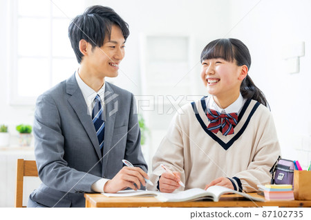 Girls and teachers studying in cram school Girls and teachers studying in cram school 87102735