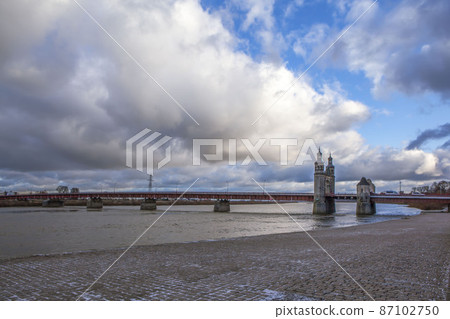 Embankment of the Neman River overlooking the Queen Louise Bridge. Sovetsk. Kaliningrad region. Russia Embankment of the Neman River overlooking the Queen Louise Bridge. Sovetsk. Kaliningrad region. Russia 87102750