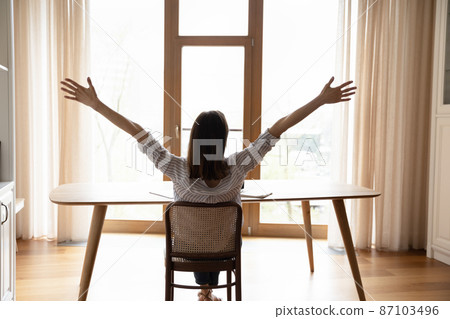 Happy relaxed young businesswoman enjoying break time. Happy relaxed young businesswoman enjoying break time. 87103496