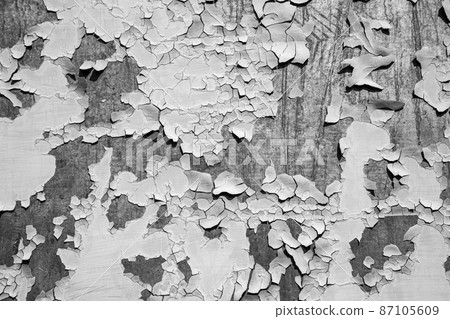 Cracked paint on mangy, metal surface, background black and white 87105609