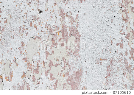 Peeling, plastered concrete wall, with remnants of paint Peeling, plastered concrete wall, with remnants of paint 87105610