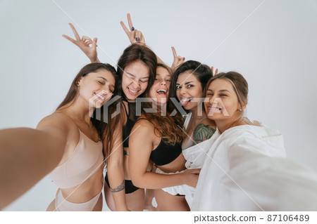 Diverse models wearing comfortable underwear take selfie 87106489