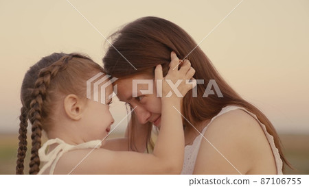 happy family. mother plays with child daughter nature. kid mom kiss and hug outdoor. happy family rest together park. baby smile kid girl. chidhood dream. happy family park. beautiful little daughter happy family. mother plays with child daughter nature. kid mom kiss and hug outdoor. happy family rest together park. baby smile kid girl. chidhood dream. happy family park. beautiful little daughter 87106755