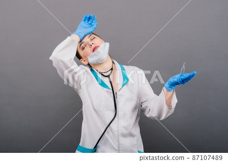 Doctor scientist with syringe analyzing virus in research vaccine to be ready for clinical trial. Doctor scientist with syringe analyzing virus in research vaccine to be ready for clinical trial. 87107489