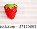 Large strawberry with cute background character space 87110693