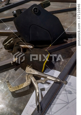 the workplace of a locksmith welder with different tools the workplace of a locksmith welder with different tools 87110946