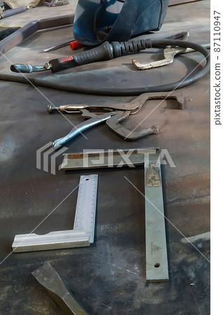 the workplace of a locksmith welder with different tools the workplace of a locksmith welder with different tools 87110947