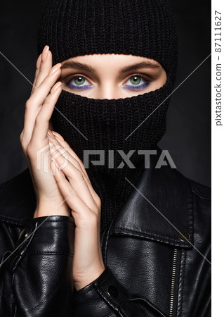 beautiful girl in black balaclava and leather coat beautiful girl in black balaclava and leather coat 87111627