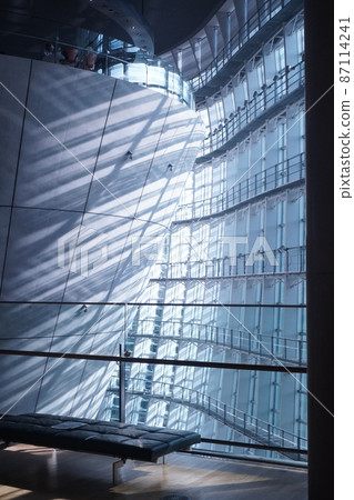 Light leaks gently from the curtain wall 87114241