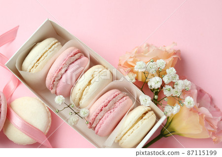 Concept of tasty dessert with macaroons on pink background Concept of tasty dessert with macaroons on pink background 87115199