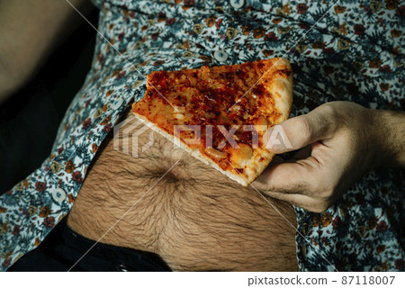 hairy man with a beer belly eats pizza hairy man with a beer belly eats pizza 87118007