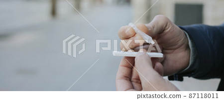 having a covid-19 rapid test on the street, banner having a covid-19 rapid test on the street, banner 87118011