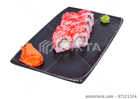 Japanese seafood Sushi roll isolated on white close up. Japanese food restaurant, sushi maki gunkan roll plate or platter set. Maki Sushi rolls with salmon and avocado. Sushi isolated at white 87121324