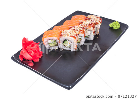 Japanese seafood Sushi roll isolated on white close up. Japanese food restaurant, sushi maki gunkan roll plate or platter set. Maki Sushi rolls with salmon and avocado. Sushi isolated at white 87121327