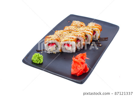 Japanese seafood Sushi roll isolated on white close up. Japanese food restaurant, sushi maki gunkan roll plate or platter set. Maki Sushi rolls with salmon and avocado. Sushi isolated at white 87121337