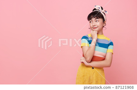 Asian child girl thinking something isolated on pink copy space background. 87121908