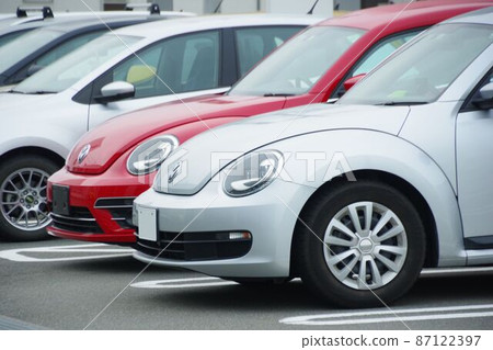 Car image Two VW The Beetle parked in the parking lot 87122397