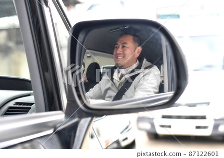 Smiley middle man driving a car Smiley middle man driving a car 87122601