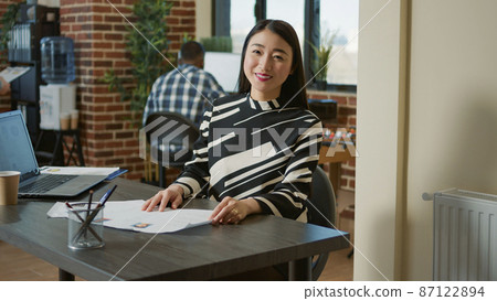 Portrait of asian HR recruiter analyzing cv resume of candidate 87122894