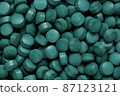 Spirulina tablets close up top view. Flat lay Healthy food supplement. Super food ingredient. top view 87123121