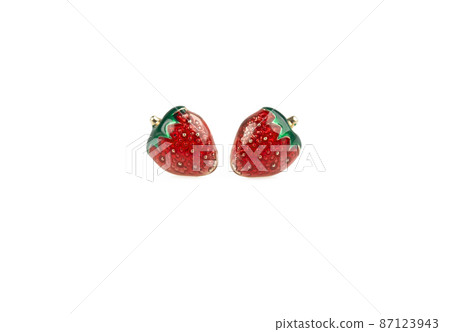 Strawberry-shaped stud earrings on white background. close up shot Strawberry-shaped stud earrings on white background. close up shot 87123943
