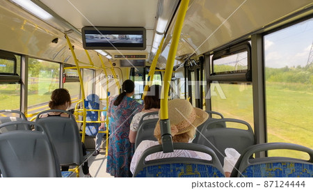 BARNAUL - JULY 21 Passengers in the bus inside view on July 21, 2018 in Barnaul, Russia BARNAUL - JULY 21 Passengers in the bus inside view on July 21, 2018 in Barnaul, Russia 87124444